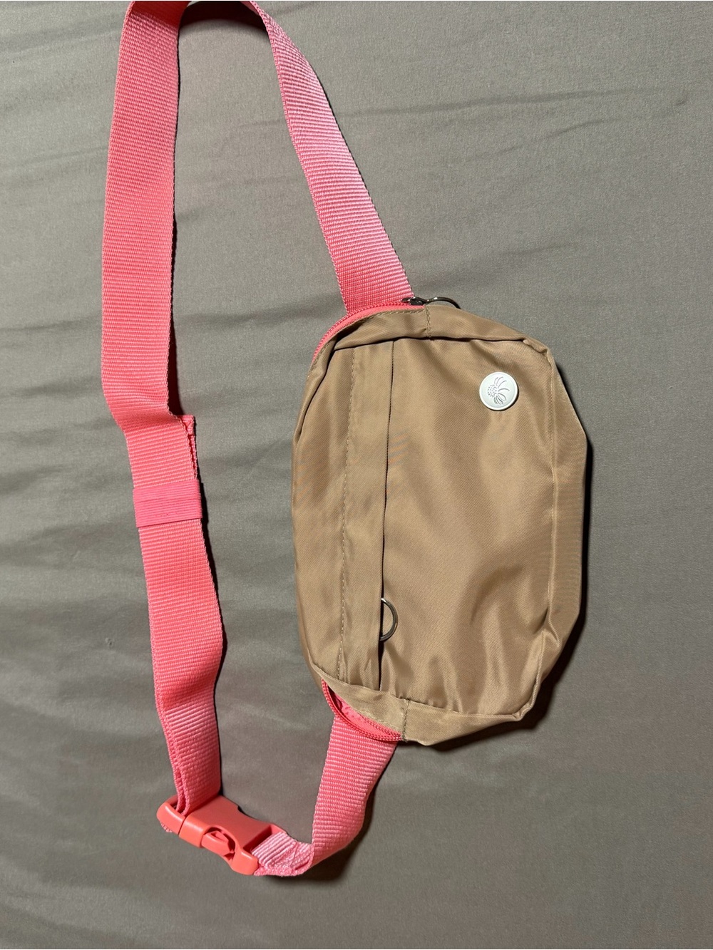 Senita Athletics tan crossbody sling with pink strap